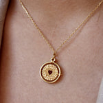 Collier doré médaille pivotante coeur pierre good karma