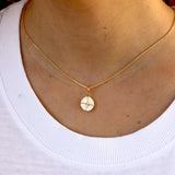 Gold necklace with Saint Lucia's eye shell and gold thread