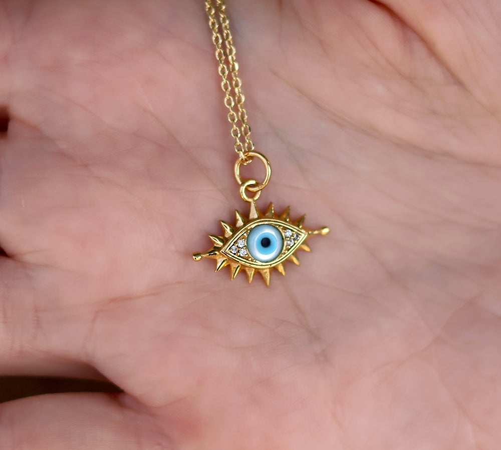 Collier doré oeil cils en nacre et zircons