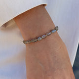 Bracelet with oval stones and golden beads
