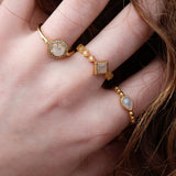 Gold ring with drop stone and zircons
