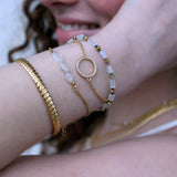 Golden bracelet with stone, tourmaline and golden discs