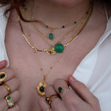Gold necklace with eye engraved in stone