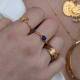 Gold ring with drop stone and zircons