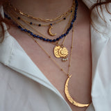 Collier doré pendentif astres