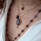 Collier doré pendentif pierre taillée brute