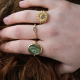 Gold ring with drop stone and zircons