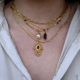 Gold and stone hand of Fatima necklace