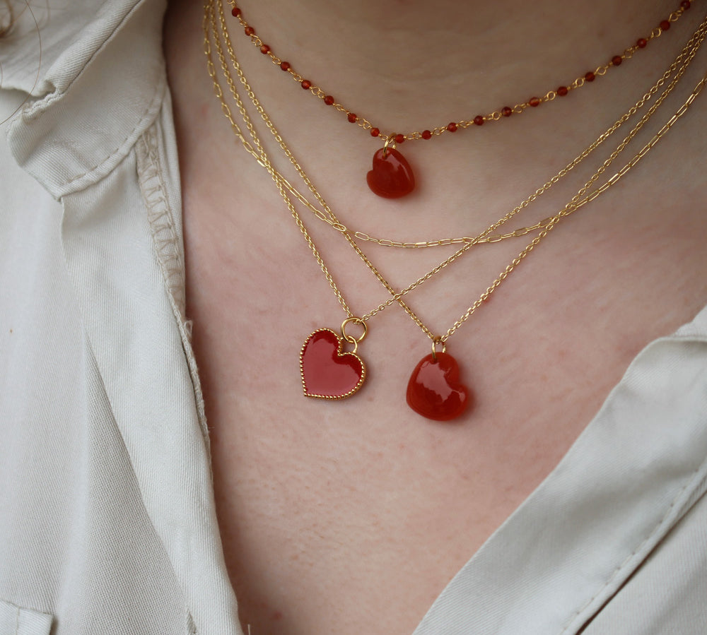 Gold necklace with small heart stone pendant