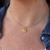 Golden sun medal necklace