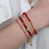 Bracelet with faceted stones and golden discs