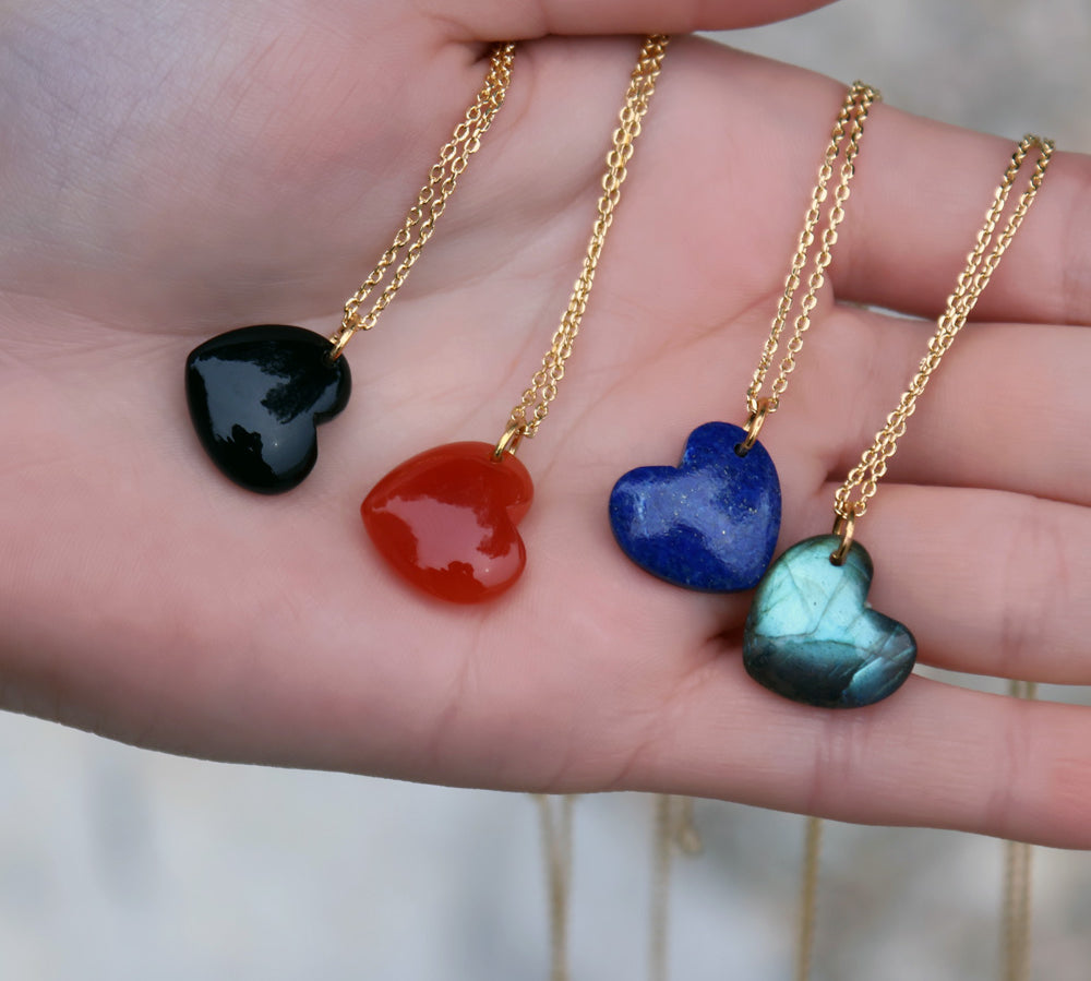 Golden necklace with large heart stone pendant