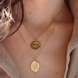 Collier doré pendentif oeil gravé
