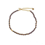 Gold ankle bracelet with round stones