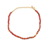 Gold ankle bracelet with round stones
